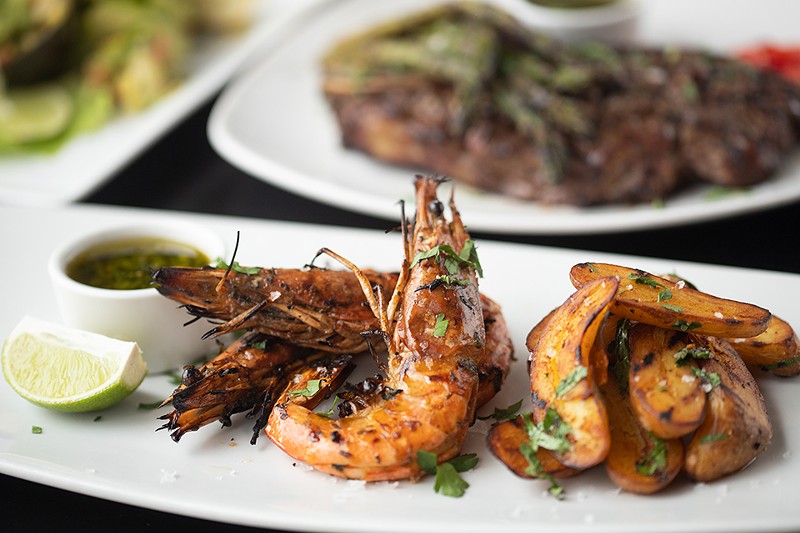 Langostinos a la parrilla, or grilled chimichurri prawns with fingerling potatoes. - MABEL SUEN