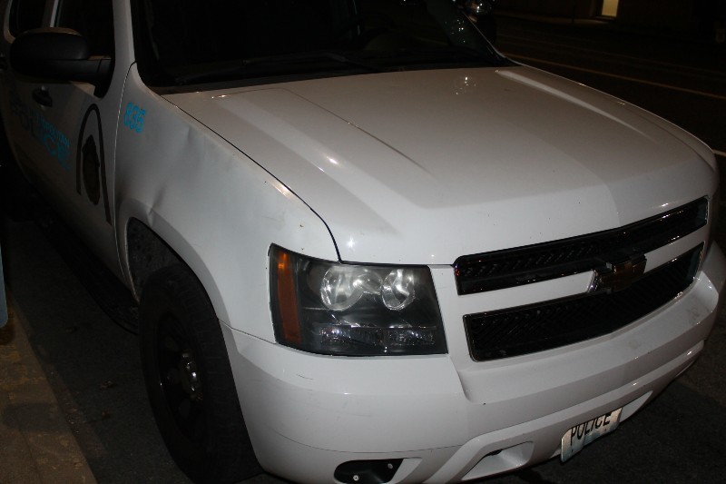 An evidence photo showing damage to the front of the police Tahoe. - ST. LOUIS METROPOLITAN POLICE