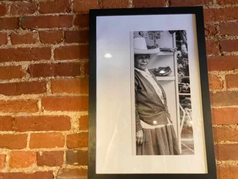 Black and white photos from Peru adorn the exposed brick walls. - CHERYL BAEHR