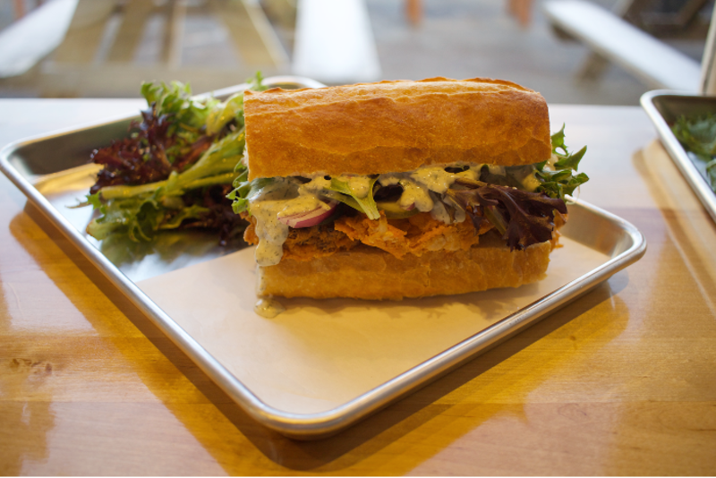 The new Buffalo cauliflower sandwich features tempura battered cauliflower, vegan ranch and a housemade baguette. - CHERYL BAEHR