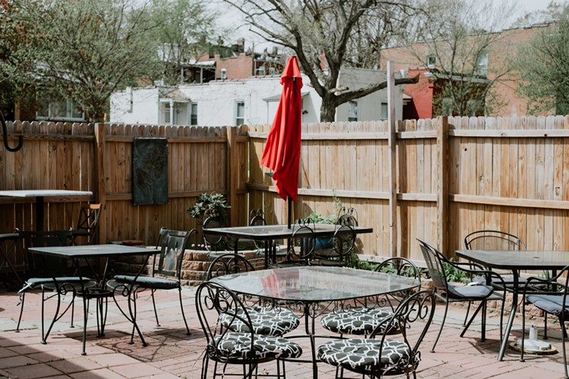 Carolyn added an outdoor patio but did not alter the essential character of the bar.  - PHUONG BUI