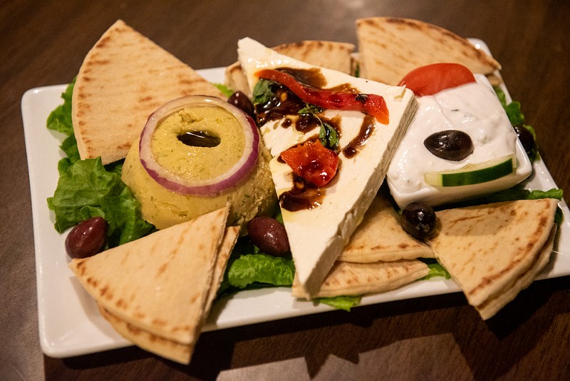 The "Spiro's Cold Platter" includes tzatziki,  hummus, kalamata olives, feta cheese and pita bread. - VU PHONG