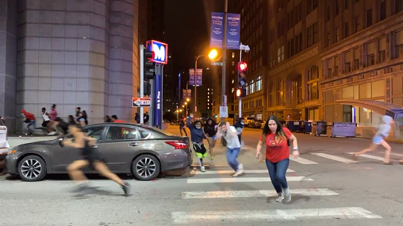 Footage captured by Derk Brown shows bystanders running from gunfire. - SCREENGRAB VIA FACEBOOK