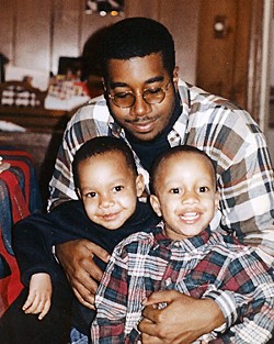 Christian Ferguson (left) and his younger sibling, who was known as Connor (right) at the time, with their father, Dawan Ferguson, in a photo from the mid-1990s. The children were born a year apart; Christian had citrullinemia but Connor did not. - Courtesy Theda Thomas