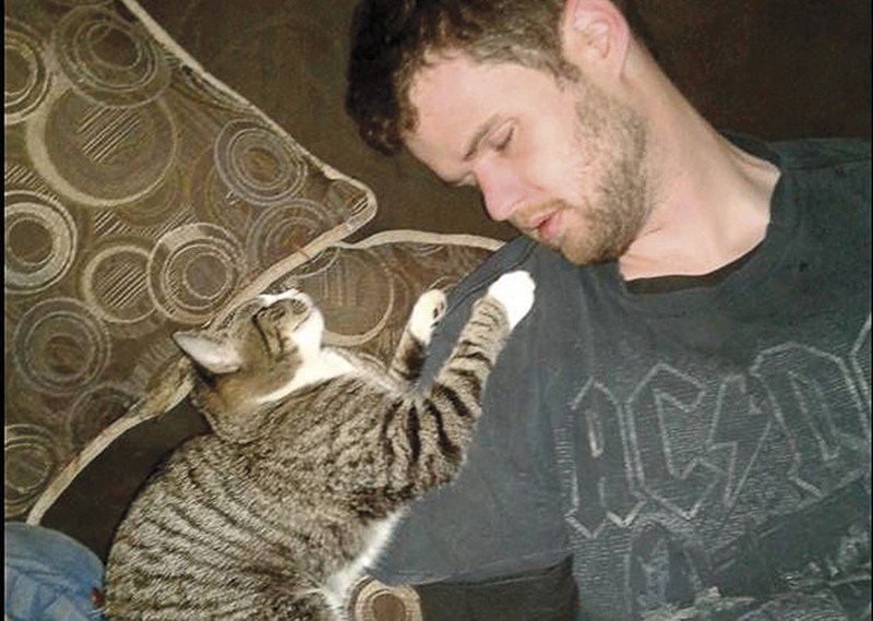 Malissa Ancona posted this picture of Paul Jinkerson Jr. and one of her cats the night before her husband's murder. - FACEBOOK
