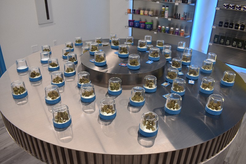 Cookies' many strains are displayed in small jars for customers to examine. - TOMMY CHIMS