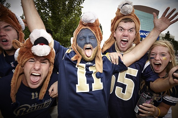 Group of excited people in Rams jerseys