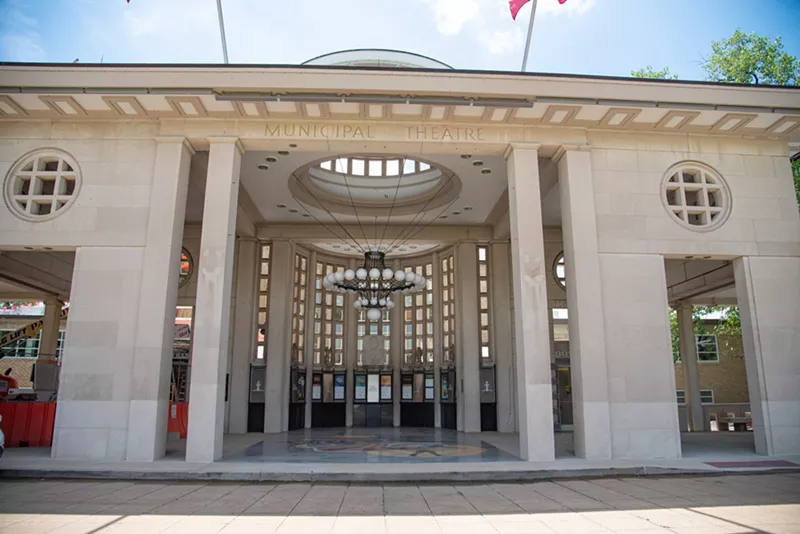 The Muny building: White stone with columns.