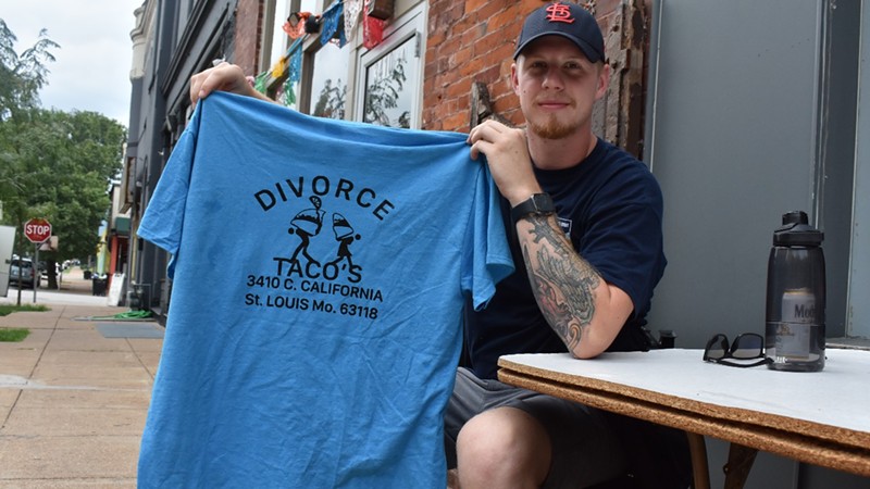Taco enthusiast and photographer Josh Bremer holds up some Divorce Tacos merch.