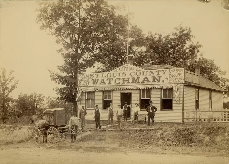 St. Louis County Watchman Office with men posing in front and horse and buggy.