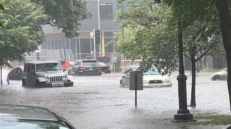 Pershing and DeBaliviere avenues on July 28, 2022 during the flash flood. Water is up to the cars' tires.
