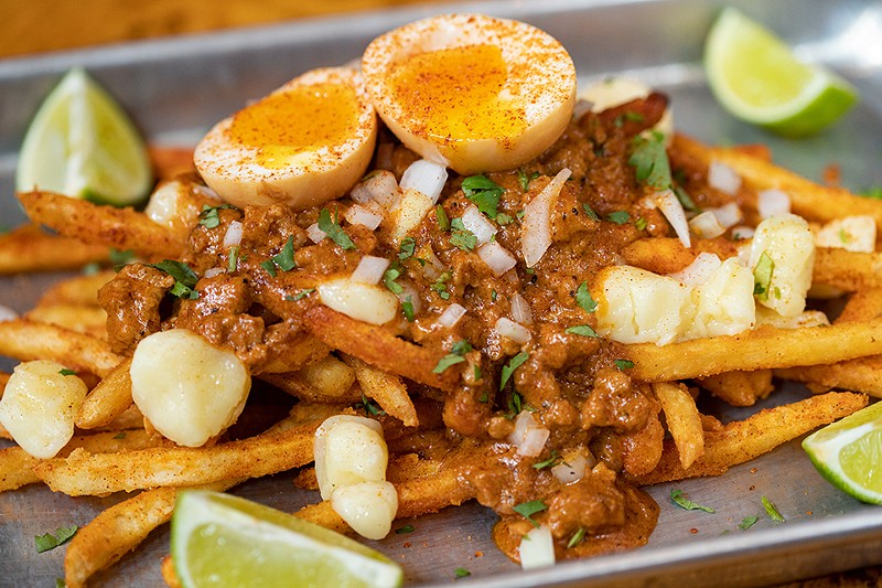 The Poutina Turner features Rock Star Dust-covered fries topped with cheese curds, chorizo gravy, onions, cilantro and limes.