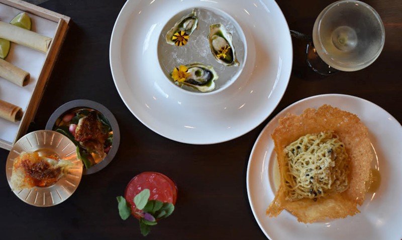 A selection of dishes from snō including (clockwise from bottom left) dumplings, tuna cigars, oysters and cacio e pepe.