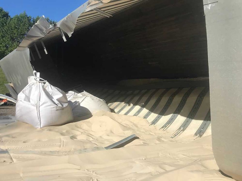 Sand spilled from the overturned tractor trailer. - RYAN KRULL