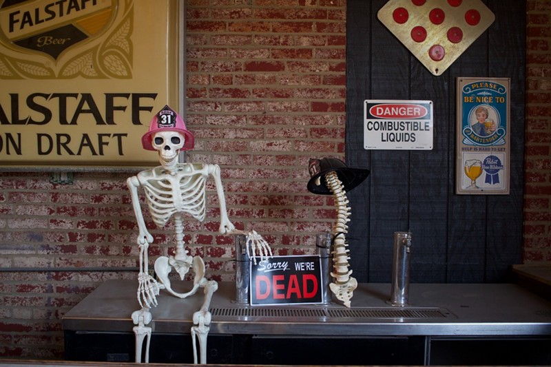 A skeleton stands watch over Eat Crow's outdoor bar.