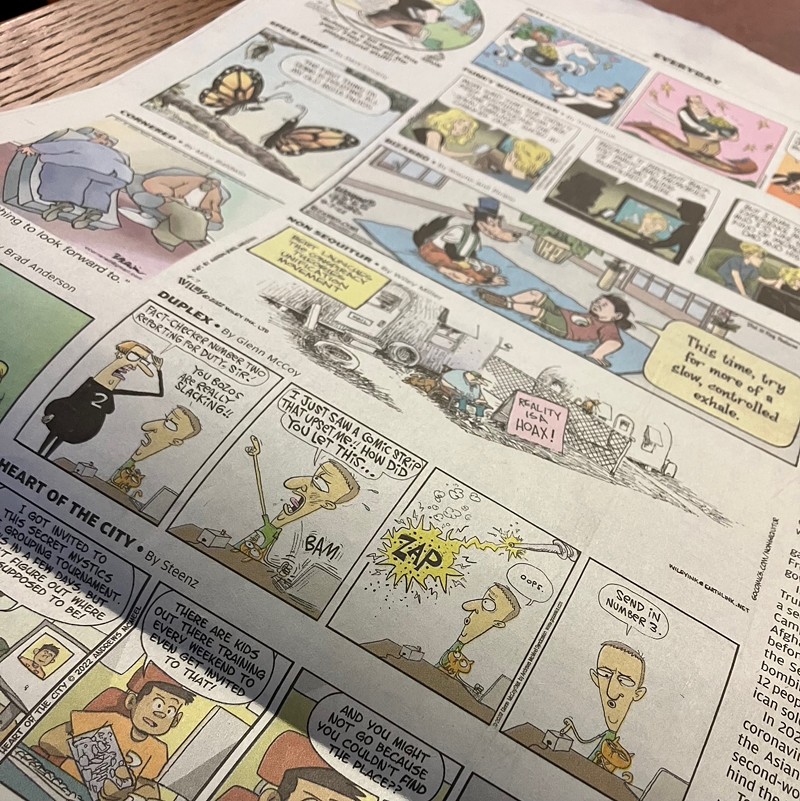 A page of comics on a newspaper