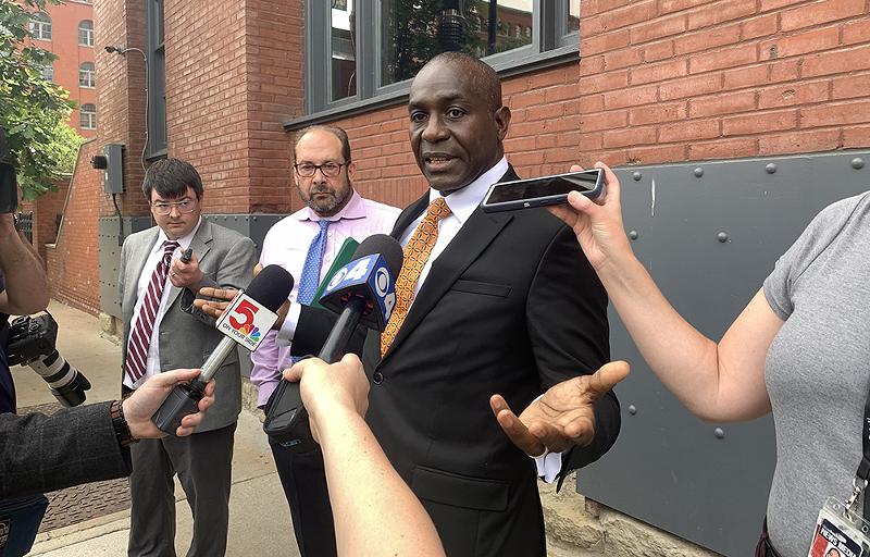 Lewis Reed speaks with reporters.