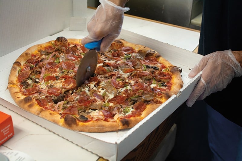 The Roberto pizza features pepperoni, hamburger, bacon, ham, capicola, sausage, garlic, mushrooms, black olives, green peppers and onions. - Andy Paulissen