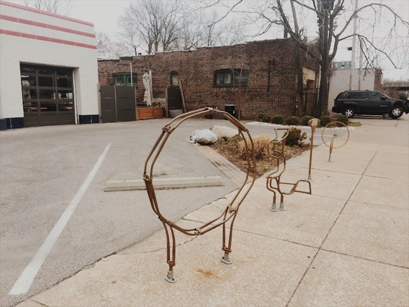 A deconstructed bike rack sits in front of Olio, the acclaimed Mediterranean-influenced restaurant in Shaw. - PHOTO BY KELLY GLUECK