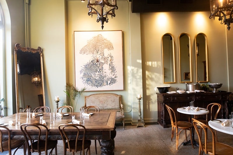 The dining room is a lovely setting for enjoying traditional French cuisine and libations.