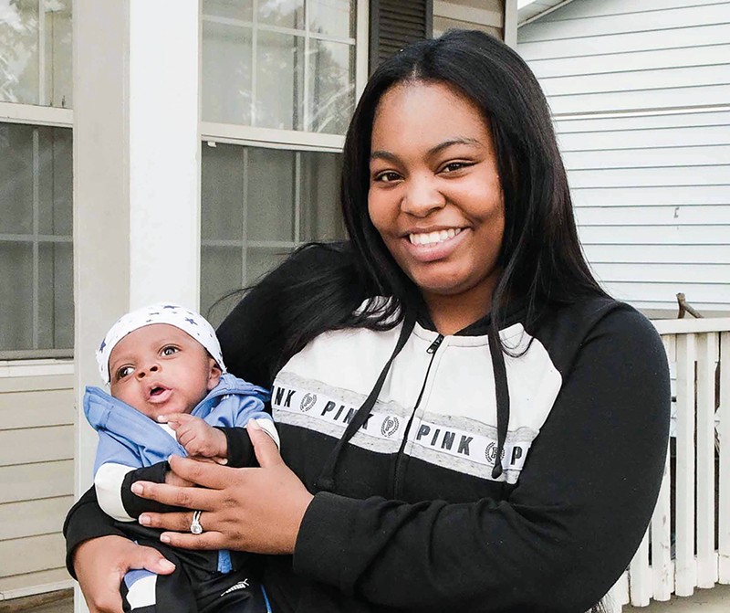 Khorry Ramey, 19, with her newborn son. She is now the same age as her father, Kevin Johnson, when he killed Sgt. William McEntee. - SARAH LOVETT