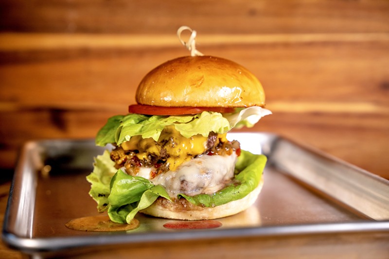 The All American Burger, featuring two burger patties, two types of cheese, cherry pepper relish and mustard sauce, is one of the menu items at the forthcoming Armory St. Louis.
