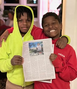 Mason, right, celebrates his RFT photo with his brother.