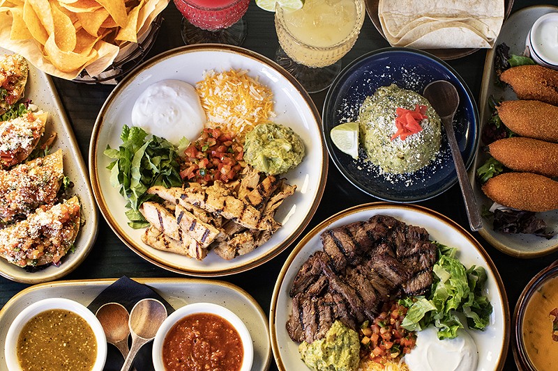 A selection of dishes, including steak and chicken fajitas, from Arzola's Fajitas + Margaritas.