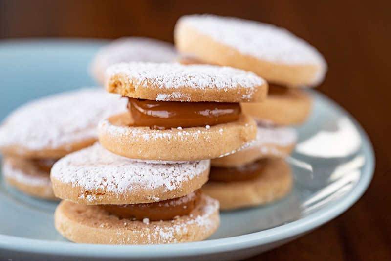 Alforjes, or shortbread cookies are filled with dulce de leche.