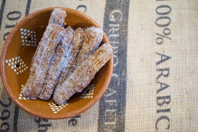 Churros are fried and covered with cinnamon and brown sugar.