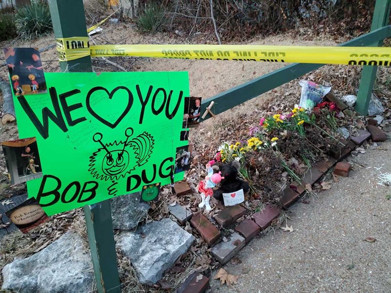 Neighbors and fans have left flowers and signs at the site of the fire in support of Bob Kramer and Dug Feltch. It's feared that Kramer died in the fire. - ROSALIND EARLY