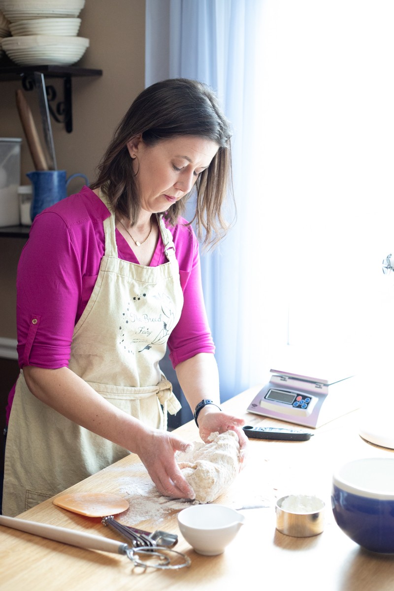 Jennifer Patneau kneads dough.