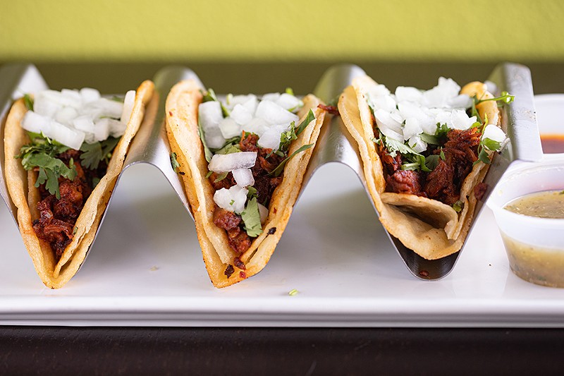 Street tacos, like these tacos al pastor, are a highlight.