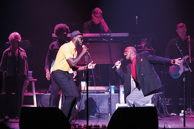 Brian Owens (left) performs on stage with his father, Thomas.