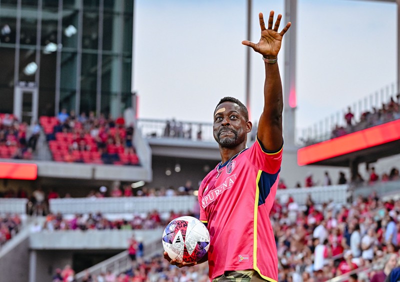 Actor Sterling K. Brown delivers match ball before Saturday's game against Miami.