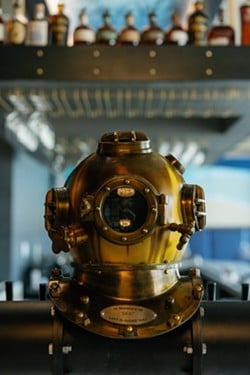 A diver's  helmet sits on the bar. - COURTESY OF NAPOLI SEA