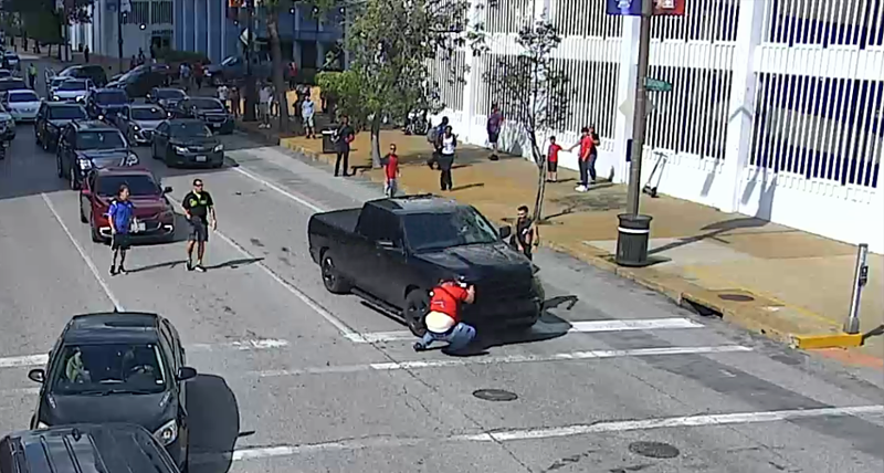 A truck driver was captured on video plowing into a man outside Busch Stadium. The RFT obtained the video via a Sunshine request. - SCREENSHOT FROM TRAFFIC CAM VIDEO