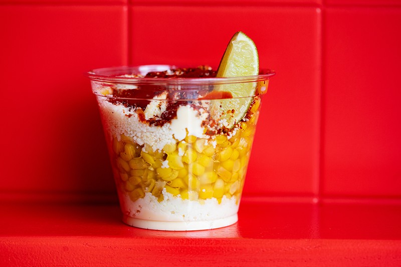 The esquites balance perfectly cooked corn with mayo and Tajín. |