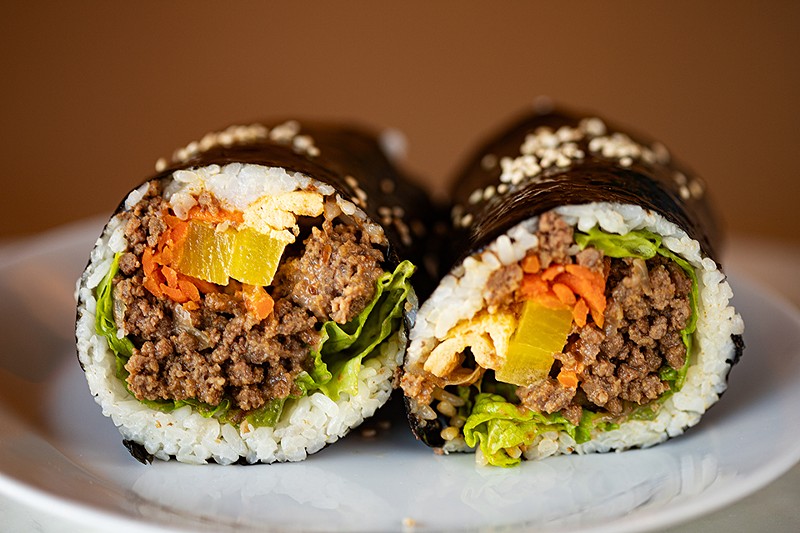 Cafe Ganadara’s bulgogi gimbap burrito is a seaweed rice roll filled with Korean marinated beef, scallions, grilled onion, red leaf lettuce and pan-fried carrot slaw.