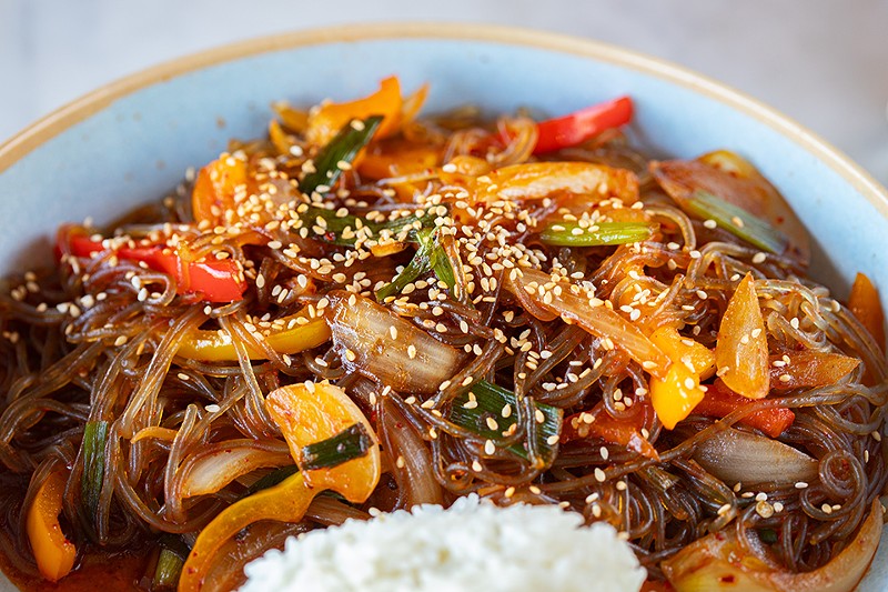 The japchae bap offers stir-fried sweet potato glass noodles with bell peppers, onion and mushrooms.