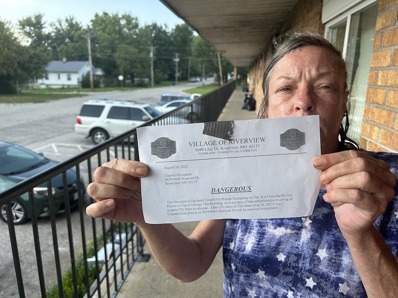 Resident Tammy Kuhn shares her eviction notice after Riverview Village condemned the Ridgeview Apartments. - MIKE FITZGERALD