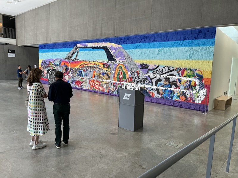 During a preview event, visitors check out Justin Favela's Ruta Madre, or Mother Road, which explores everything from lowrider culture to St. Louis' place as "Gateway to the West."
