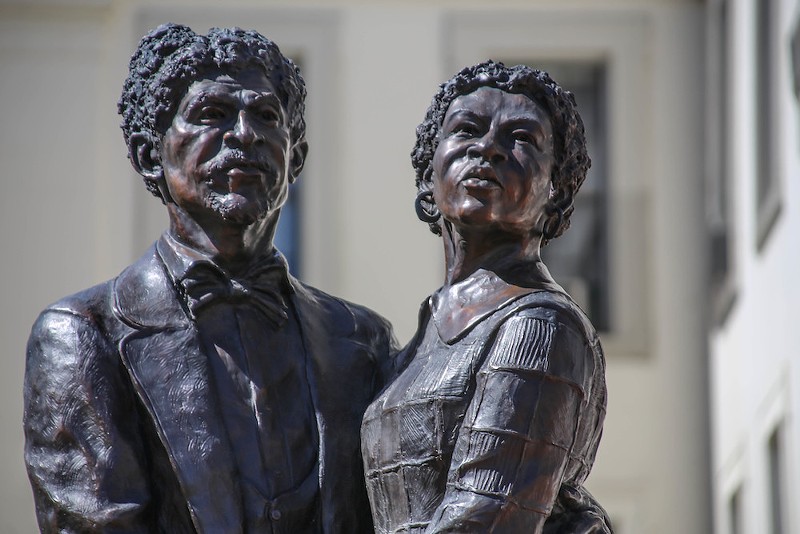 A statue of Dred Scott and Harriet Robinson Scott stands outside the old courthouse in downtown St. Louis. - FLICKR/PAUL SABLEMAN
