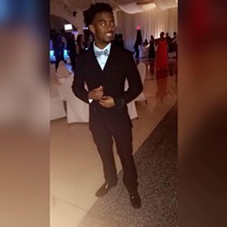 Kendrick Woods, suited up for prom in 2016. A year later he would be dead. - COURTESY LIN WOODS