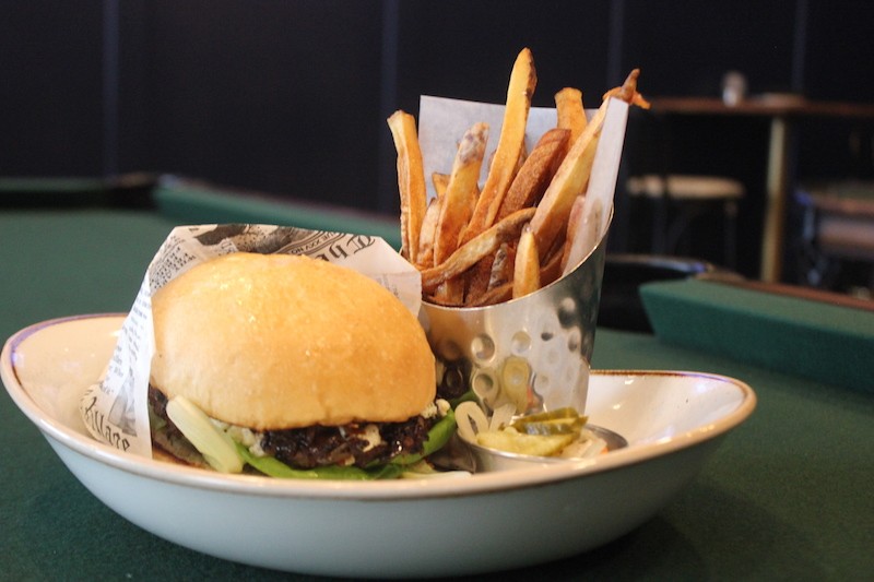 The house burger comes topped with boursin and carmelized onions. - PHOTO BY SARAH FENSKE