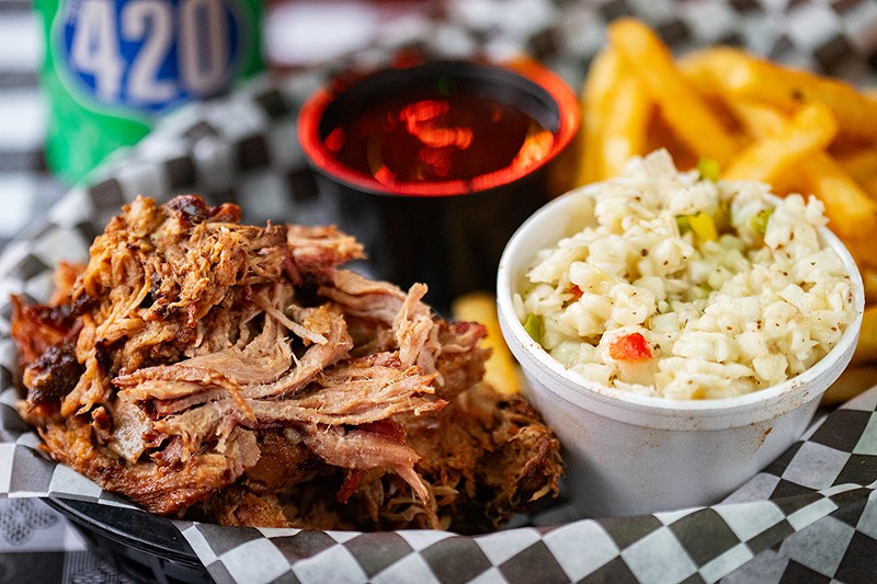 The pulled pork dinner is served with two sides.
