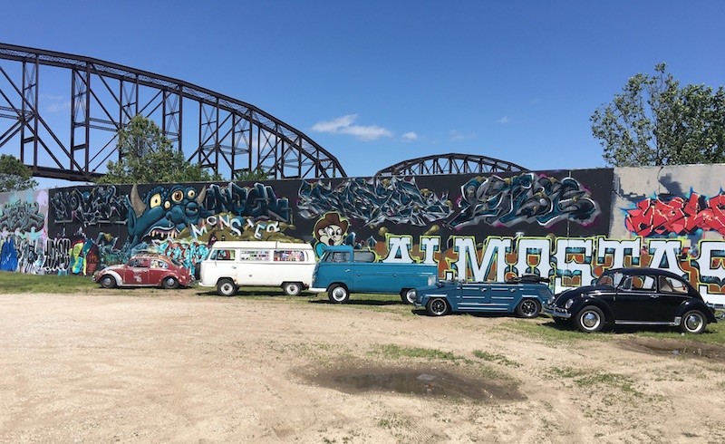 Vintage Volkswagen models gather near the Graffiti Wall in downtown St. Louis. - COURTESY OF AIR COOLED ANTIQUES