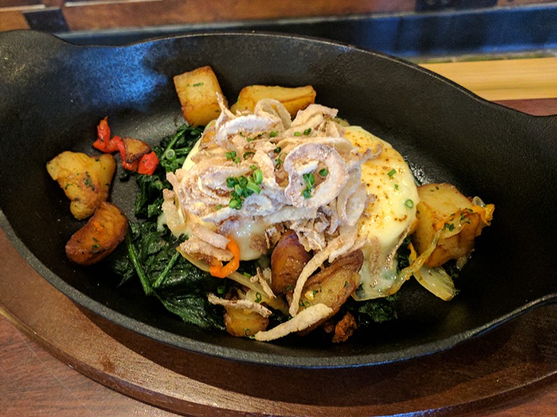 Flash-fried onions provide a crunchy topping to the South Side Florentine: poached eggs on a bed of creamy spinach, swiss cheese and breakfast potatoes. - PHOTO BY DANNY WICENTOWSKI