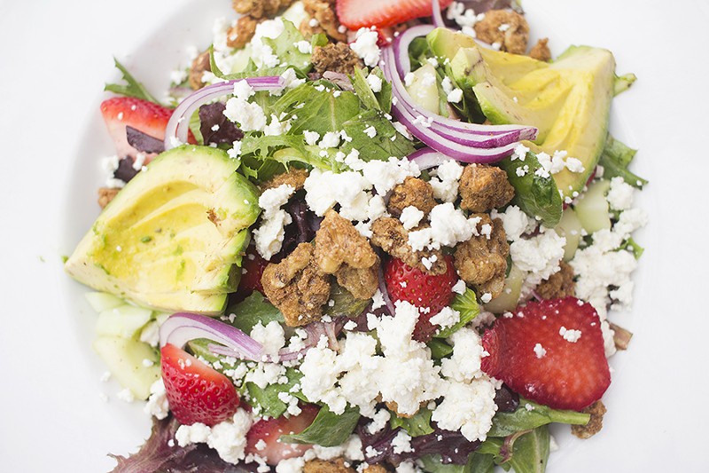 The "Strawberry Fields" salad includes strawberries, avocado, cucumbers, red onions, candied walnuts, feta cheese and lemon-pepper vinaigrette. - PHOTO BY MABEL SUEN
