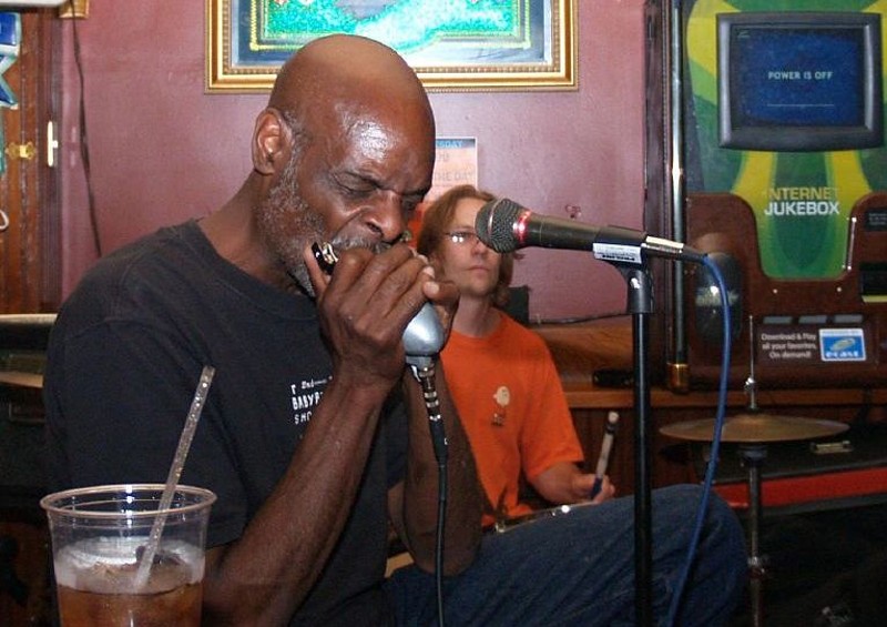 Eric McSpadden performing. The blues musician is known for his harmonica work. - Photo by Christina Rutz / Flickr